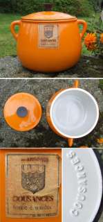   pot in zingy orange made by cousances moulded inside the lid unused it