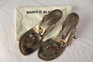  Blahnik jeweled thong sandals in a metallic bronze. These sandals 
