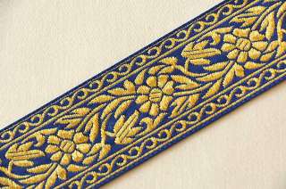 Jacquard ribbon trim. Metallic gold flowers on royal blue background.