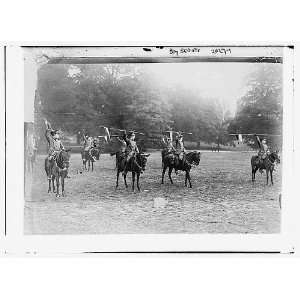   Boy Scouts. On Horseback with spears held aloft. 1900