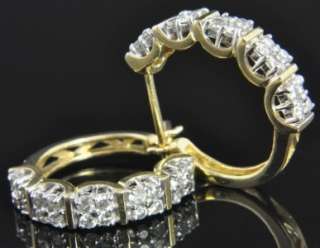   of diamond hoop earrings crafted from solid 14K yellow & white gold