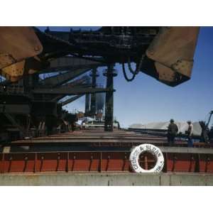  Electric Cranes Unload Iron Ore from a Great Lakes 