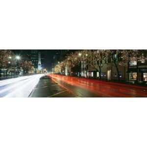 Motion of Cars Along Michigan Avenue Illuminated with Christmas Lights 