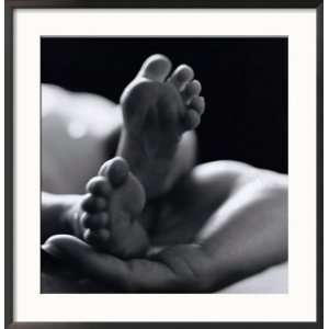 Babys Feet in the Palm of the Parents Hand Framed Photographic 