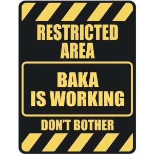   RESTRICTED AREA BAKA IS WORKING  PARKING SIGN