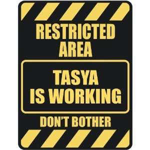   RESTRICTED AREA TASYA IS WORKING  PARKING SIGN
