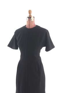 Mid to late 1950s black wool dress. Hourglass cut, front center seam 