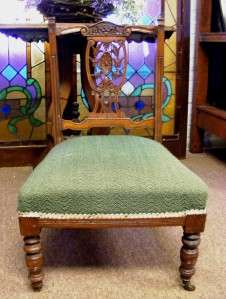 ~ wooden chair has a carved design in the wooden back. The wood 