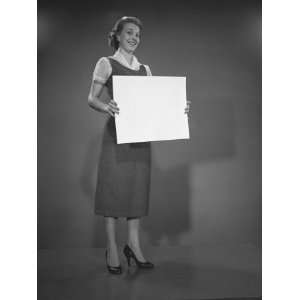  Woman Holding Blank Sheet of Paper in Studio, Photographic 