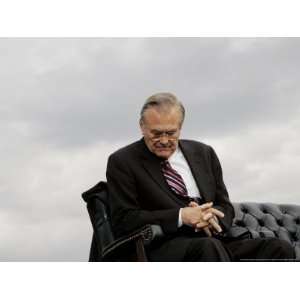 Outgoing Secretary of Defense Donald Rumsfeld Looks Down as He Sits on 