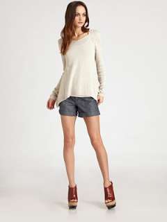 Wide v neck Dropped shoulders Long sleeves Ribbed trim at cuffs and 