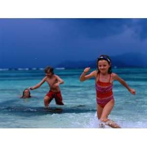  Children Running Out of Ocean in Stormy Weather, Seychelles 